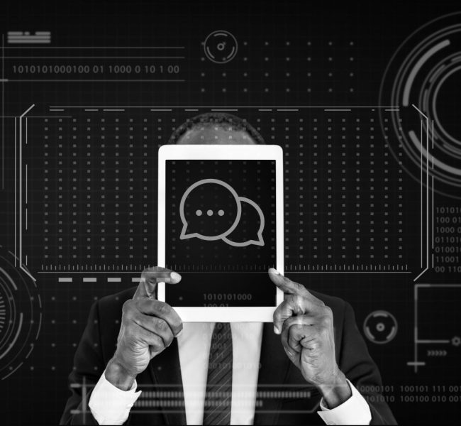 Man using a tablet with a digital chat interface